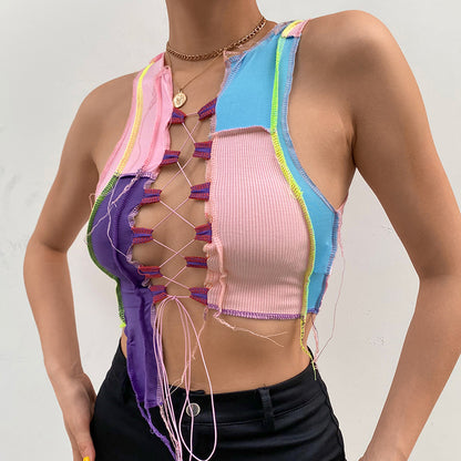 a mannequin wearing a pink, blue, and purple top